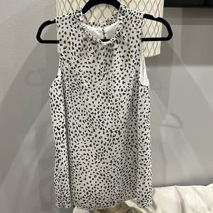 Black and white sleeveless blouse